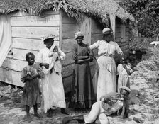Negro family, Grant's Town, Nassau, W.I., between 1900 and 1906. Creator: William H. Jackson.