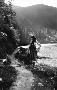 Young woman on a mountain footpath, Bistrita Valley, Moldavia, north-east Romania, c1920-c1945. Artist: Adolph Chevalier