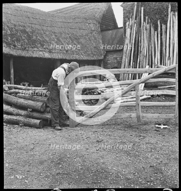 Man making a field gate in the village of Aston, Cote, Shifford and Chimney, Oxfordshire, 1930-50. Creator: George R Long.