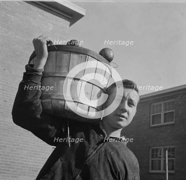 Young huckster in the Southwest section, Washington, D.C., 1942. Creator: Gordon Parks.