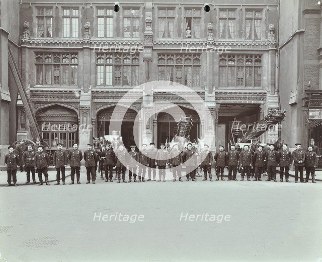 Firemen lined up outside Bishopsgate Fire Station, Bishopsgate, City of London, 1908. Artist: Unknown.