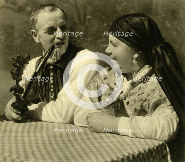 Couple in traditional dress, Upper Austria, c1935.  Creator: Unknown.
