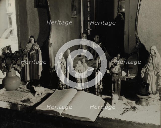 Religious objects and an improved altar in the bedroom of Mrs. Watson..., Washington, D.C., 1942. Creator: Gordon Parks.