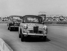 Riley 1.5, Grace leads Jack Sears in Austin Westminster at Silverstone 1958. Creator: Unknown.