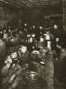Russian manual labourers eating a meal, late 19th century. Artist: Unknown