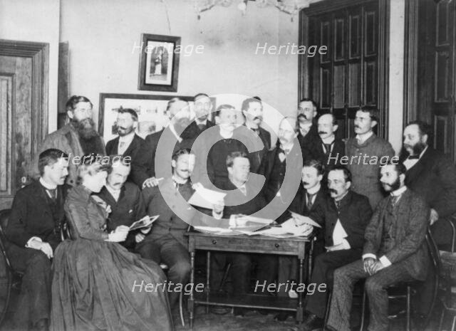 Frances Benjamin Johnston and Washington Camera Club looking at pictures, c1890. Creator: Frances Benjamin Johnston.
