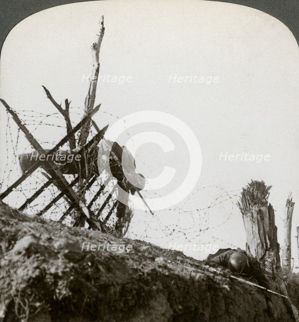 Dead German soldiers on the wire after a night raid, Givenchy, France, World War I, 1914-1918.Artist: Realistic Travels Publishers