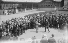 Presenting pen to Wallis, between c1915 and c1920. Creator: Bain News Service.