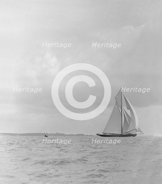 The racing cutter 'Terpisichore' running downwind, 1922. Creator: Kirk & Sons of Cowes.