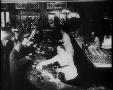 American Civilians Celebrating the End of Prohibition Drinking in a Bar, 1930s. Creator: British Pathe Ltd.