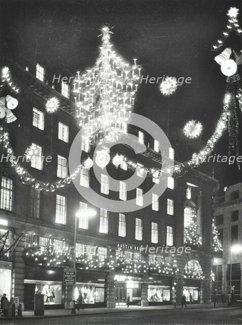 Christmas illuminations on Regent Street, West End, looking to Austin Reed at 103-113, London, 1970. Creator: Unknown.