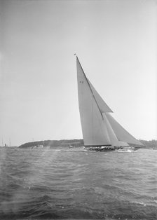 The 23-metre cutter 'Astra' sailing close-hauled, 1934. Creator: Kirk & Sons of Cowes.