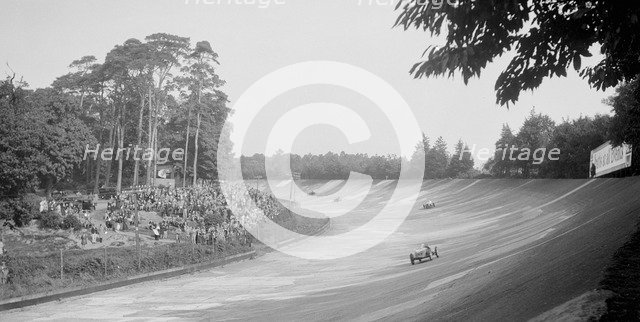 Riley 9 Brooklands on the banking at Brooklands. Artist: Bill Brunell.