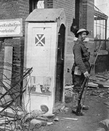 A British soldier on sentry duty after the fall of Peronne, France, First World War, 1917, (c1920). Artist: Unknown
