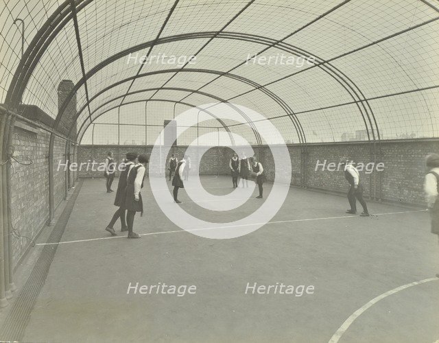 Girls playing netball on a roof playground, Barrett Street Trade School, London, 1927. Artist: Unknown.