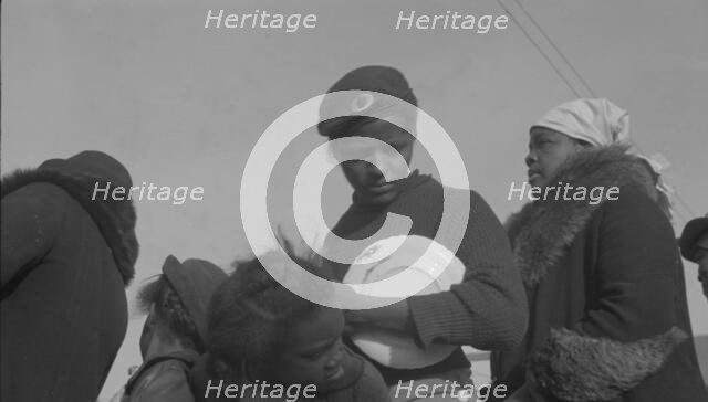Possibly: Negroes in the lineup for food at mealtime in the camp..., Forrest City, Arkansas, 1937. Creator: Walker Evans.