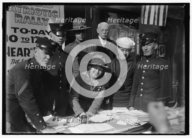 Dora Rodrigues, recruiter for service branches, possibly in front of the Cosmos Theater..., May 1917 Creator: Harris & Ewing.