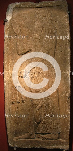 Priest with a branch of pomergranate tree. Detail of a relief from the palace of Assyrian king Sargon II, 722-705 BC. Artist: Assyrian Art  