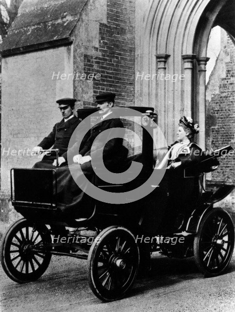 Two chauffeurs driving a convertible City and Suburban electric car. Artist: Unknown