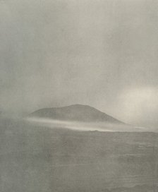 'The Start of a Blizzard...Drift Coming Round Mount Erebus', c1908, (1909). Artist: Unknown.