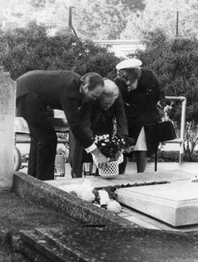 Lady Churchill laying a wreath on the grave of Sir Winston Churchill, Bladon, Oxfordshire, 1974. Artist: Unknown