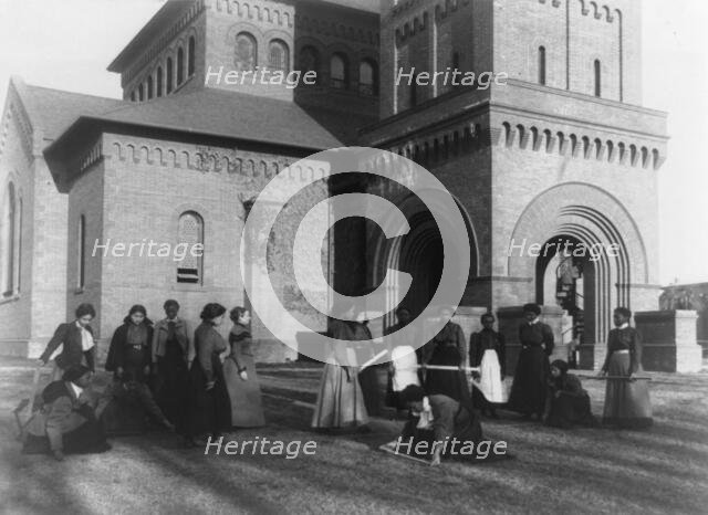 Girls measuring piece of ground in arithmetic class at Hampton Institute, Hampton, Va., 1899 or 1900 Creator: Frances Benjamin Johnston.