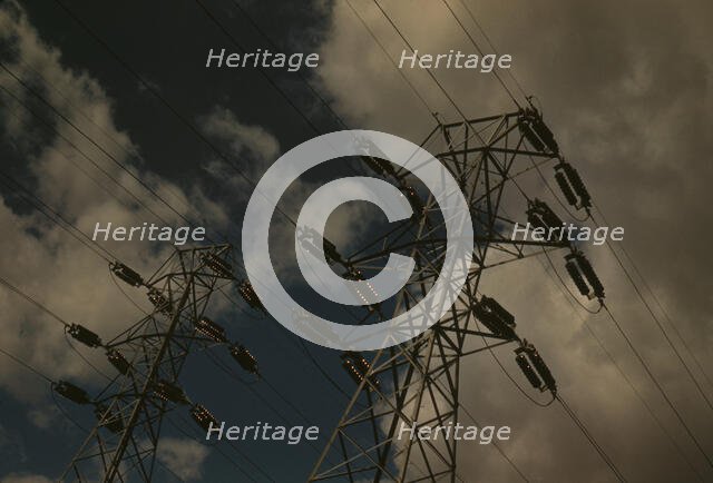 Insulators and transmission wires in the switchyard of the TVA's Chickamauga Dam..., Tennessee, 1942 Creator: Alfred T Palmer.