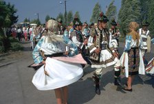 Dancers at a Hungarian folklore festival. Artist: CM Dixon Artist: Unknown