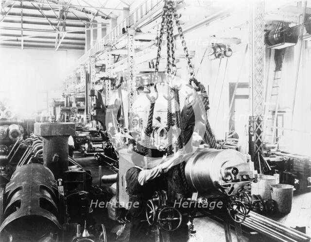 Getting ready to hoist a mounted gun, in Washington Navy Yard(?), 1903. Creator: Frances Benjamin Johnston.