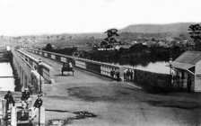 Crossing the first permanent Victoria Bridge, Brisbane, c1874. Creator: Unknown.