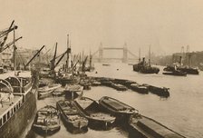 'Shipping in the Pool of London: A Vista from London Bridge to Tower Bridge', c1935. Creator: Donald McLeish.