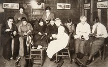 A group of women receive a lesson in boot repairing, World War I, c1914-c1918. Artist: S and G