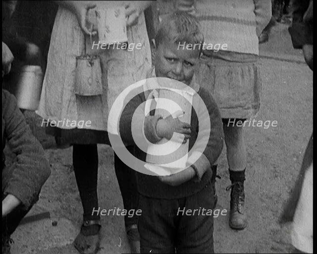 A Boy Clutching a Jug To His Chest and Crying, 1924. Creator: British Pathe Ltd.