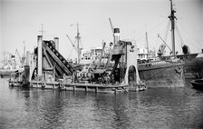 A dredger moored in Tilbury Docks, Essex, c1945-c1965. Artist: SW Rawlings