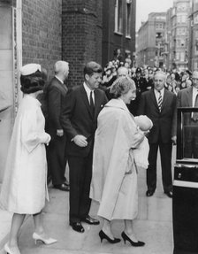 President John F. Kennedy and his wife attend a christening at Westminster Cathedral, London, 1961. Artist: Unknown