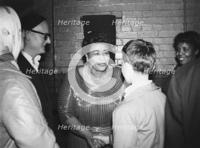 Ella Fitzgerald with Max Jones, London, 1961. Creator: Brian Foskett.
