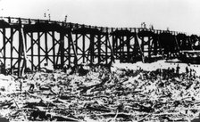 Workers below Victoria Bridge, cleaning up debris after the flood, Brisbane, 1893. Creator: Unknown.