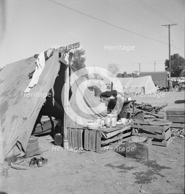 Migratory labor housing during carrot harvest, near Holtville, Imperial Valley, California, 1939. Creator: Dorothea Lange.