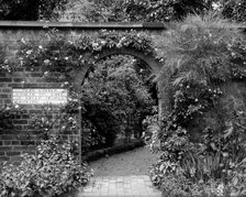  Entrance to the herb garden in Wardrobe Court, Hampton Court Palace, Richmond, London. Artist: Alfred Newton & Sons