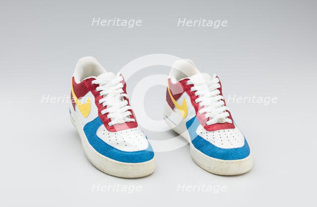 Red, white, yellow, and blue Nike sneakers worn by Big Boi of Outkast, 2005-2006. Creator: Nike.