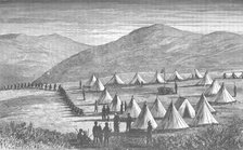 'Sir Garnet Wolseley's Camp at Ulundi: Zulus Coming In To Give Up Their Arms', c1880. Artist: Unknown.