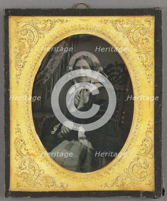 Portrait of a woman in bonnet, seated, about 1850. Creator: Unknown.