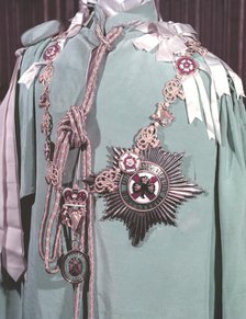 The robes, regimental badge and insignia of the Irish Guards, 1953.  Creator: Arthur Charles Kirby Ware.