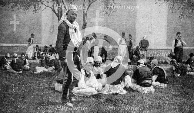 A meeting of Mirdite mountaineers and their town kinsmen outside a Scutari cathedral, Turkey, 1922. Artist: Unknown