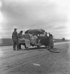 Migrants, family of Mexicans, on road with tire trouble, looking for work..., CA, 1936. Creator: Dorothea Lange.