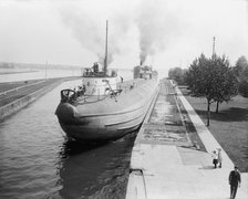 Whaleback entering Weitzel Lock, Sault Sainte Marie, Mich., between 1900 and 1910. Creator: Unknown.