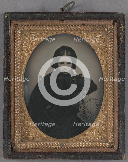 Portrait of a young girl dressed in dark clothes, wearing dark gloves, about 1860. Creator: Unknown.