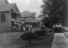 Group of women and a few boys outside Roycroft shop, East Aurora, N.Y., 1900. Creator: Frances Benjamin Johnston.