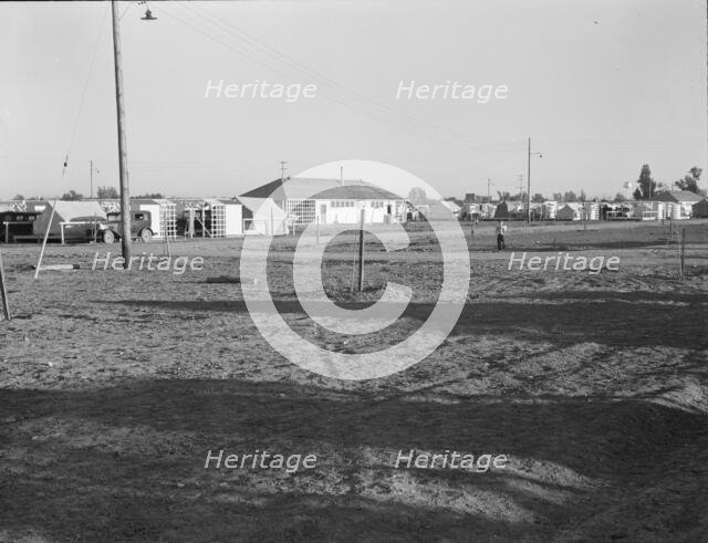 Migratory labor camp during pea harvest, FSA, Brawley, Imperial Valley, California , 1939. Creator: Dorothea Lange.