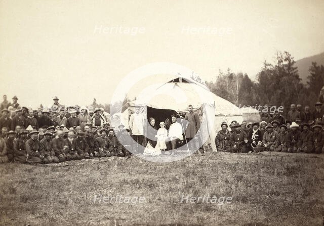 Group of Kirghiz (ie Kazakh) men posing with a local Russian Governor, his..., between 1885 and 86. Creator: Unknown.